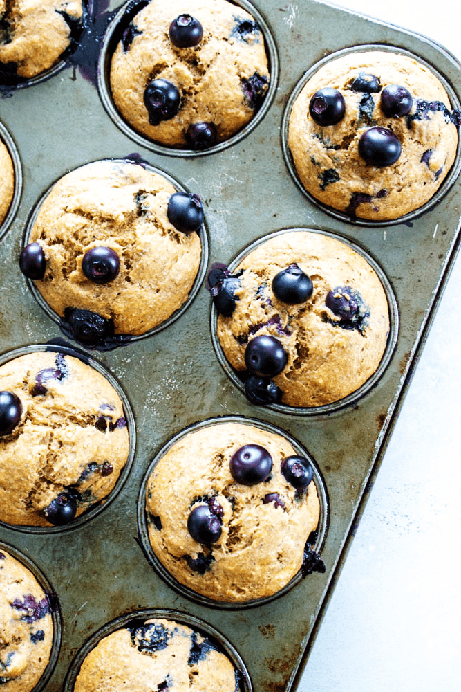 Healthier Banana Blueberry Muffins baked in a muffin pan
