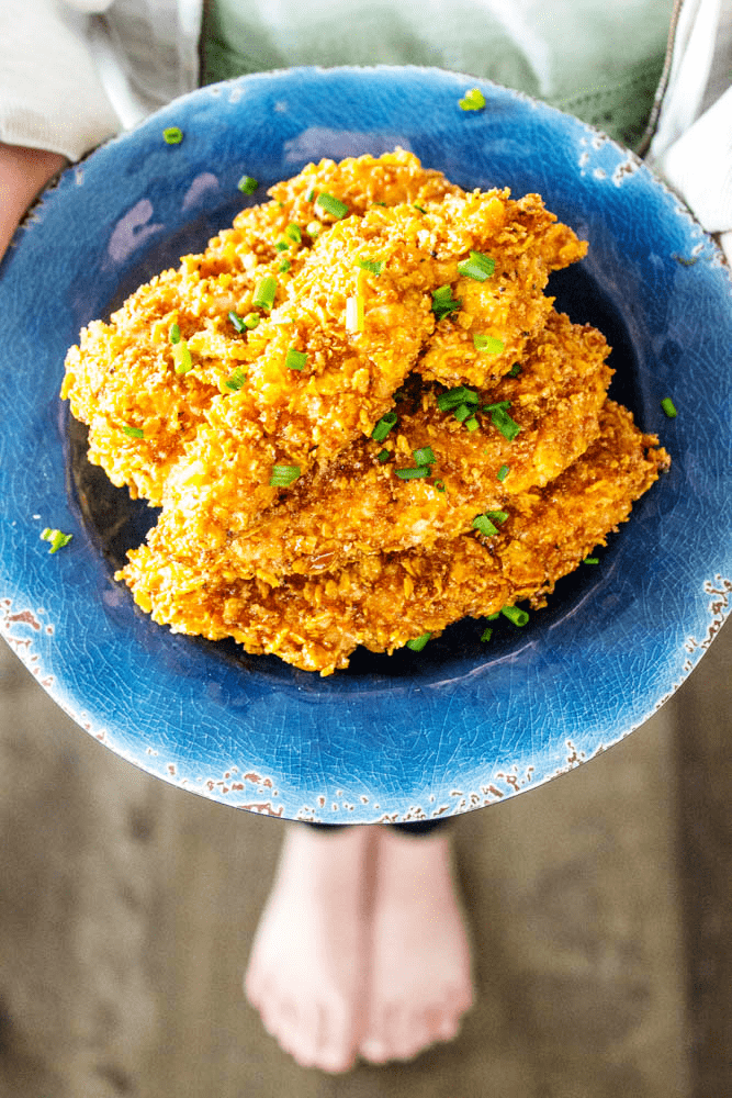 Baked Honey Garlic Chicken Tenders stacked on a plate