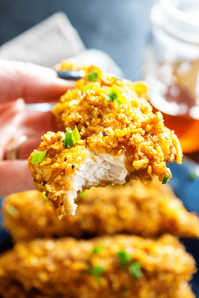 up close Baked Honey Garlic Chicken Tender with a bite taken out