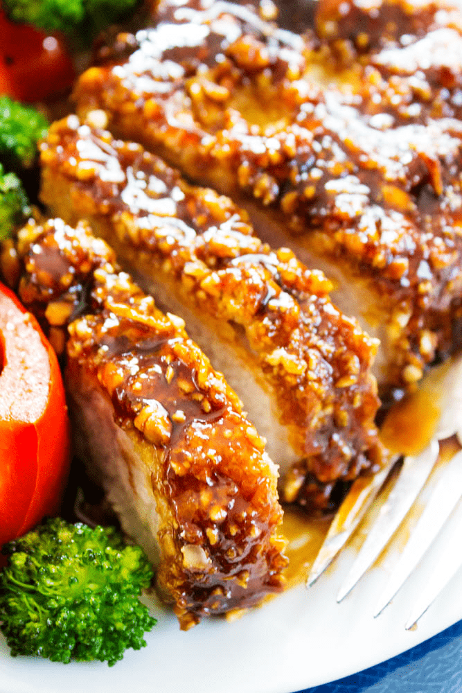Cashew Oven-Fried Pork Chop sliced, served on a plate