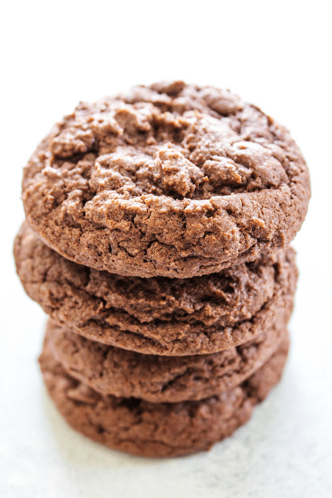 EASY WHOOPIE PIE RECIPE- Soft and chewy Devil's Food cake cookies sandwiched with cream cheese frosting, these whoopie pies are out of this world. chocolate cake cookies in a stack