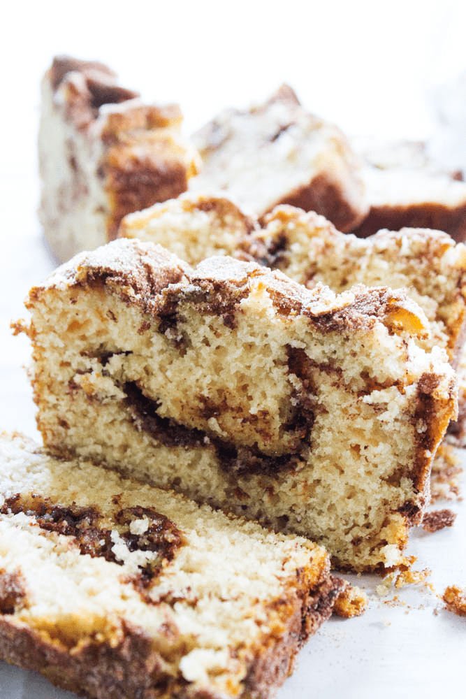 CINNAMON SUGAR BREAD is like eating a cinnamon & sugar cake donut but better. Easy & delicious this bread is ready to devour in an hour. photo of sliced cinnamon sugar bread loaf