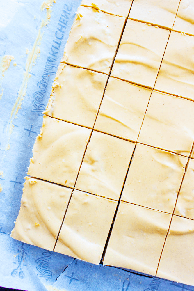 Peanut Butter Oatmeal Bars sliced into squares on parchment