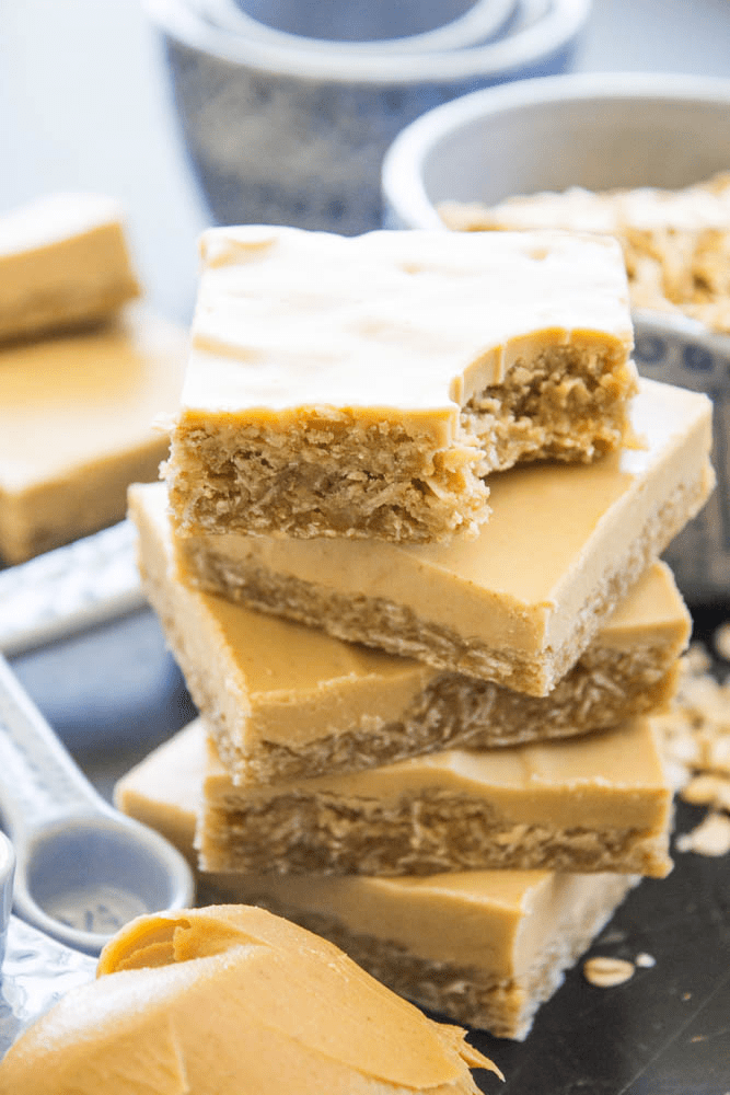 Peanut Butter Oatmeal Bars stack of 4 with bite taken from top one. 
