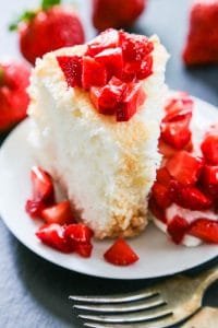 Angel Food Cake is a summer must have in our home. Light and fluffy, with the perfect amount of sweetness, this recipe for homemade angel food cake is so easy to make from scratch.