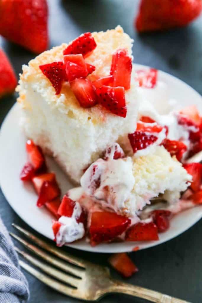 shot of single slice of angel food cake with strawberries