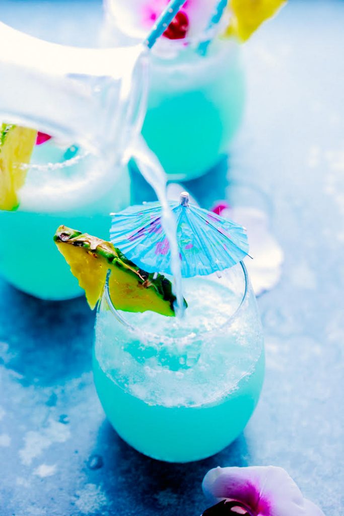Refreshing & easy this Blue Island Cocktail/Mocktail is made with pineapple juice, limeade, pina colada mixer and lime juice, you can add rum for the adults. Refreshing & easy this Blue Island Cocktail/Mocktail is made with pineapple juice, limeade, pina colada mixer and lime juice, you can add rum for the adults.