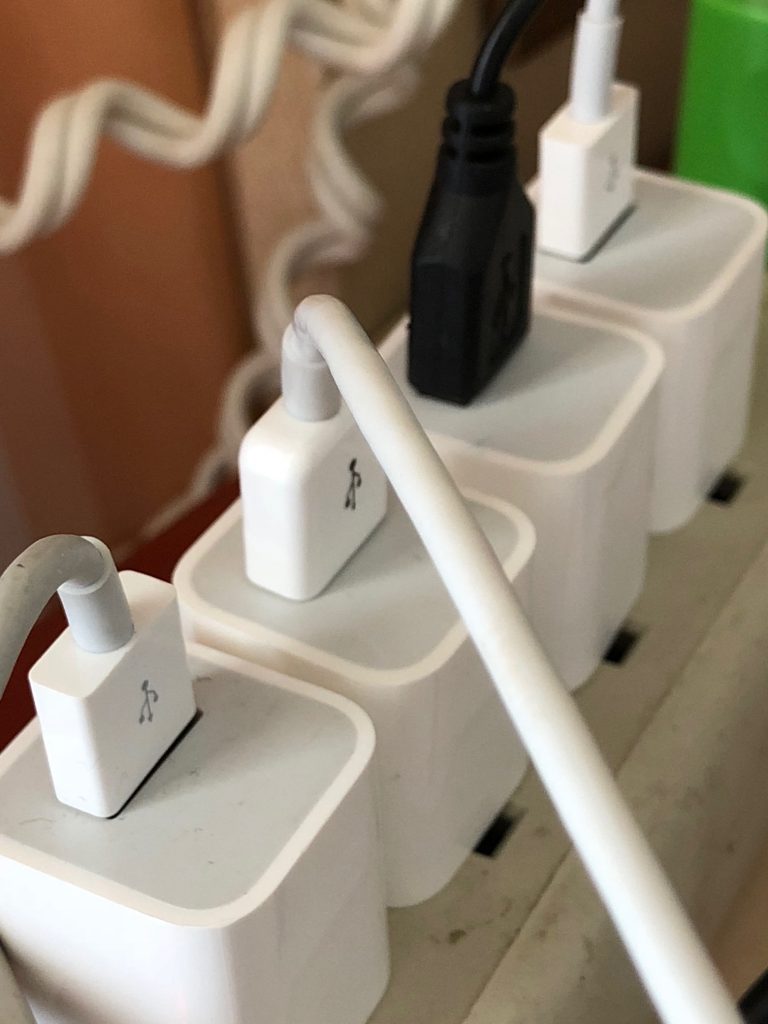 charging cords plugged into a power strip