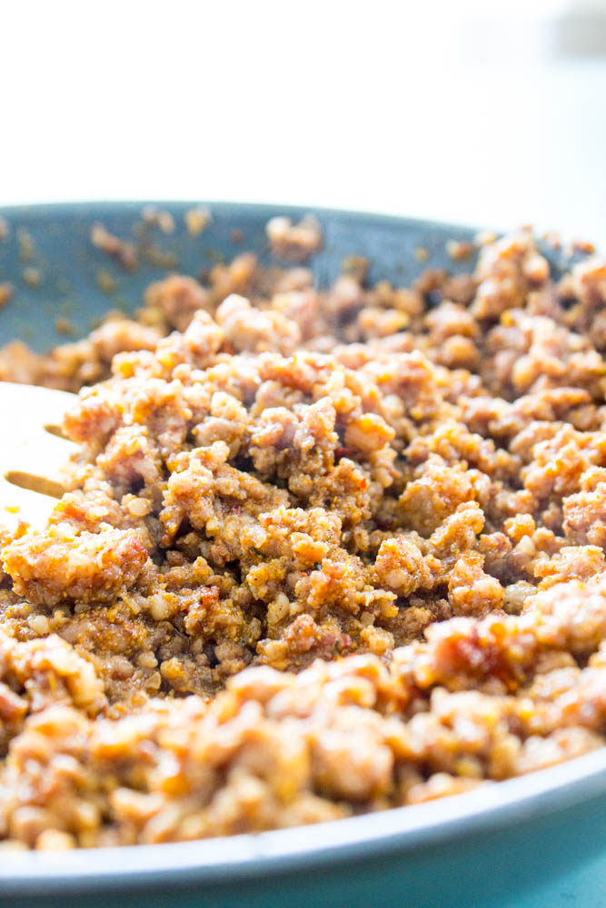 Ground pork with taco seasoning in a skillet