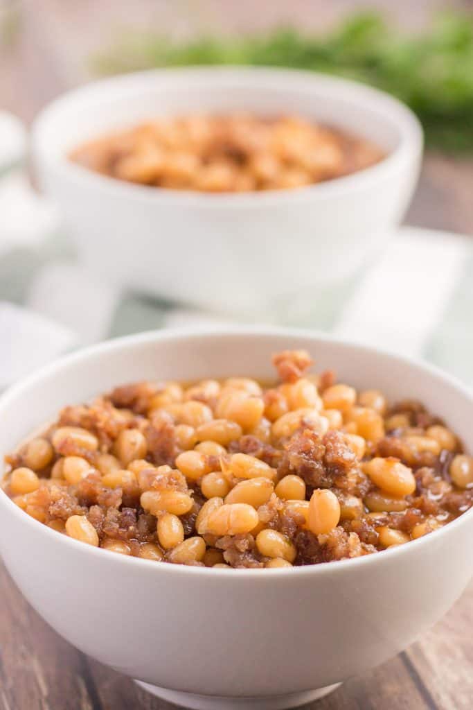 photo of beans and ground sausage in a white bowl