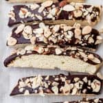 biscotti on bakig sheet with chocolate and almonds