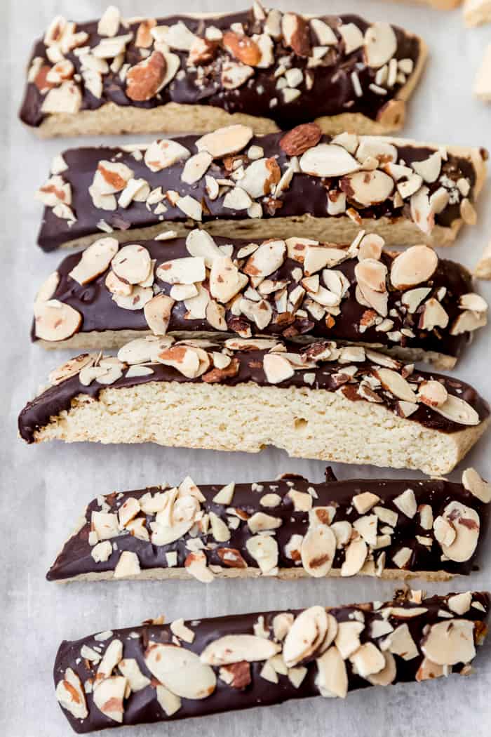 biscotti on bakig sheet with chocolate and almonds