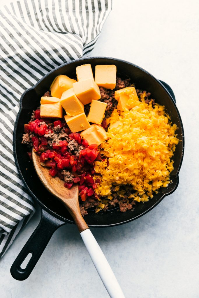 ingredient for beef queso dip in skillet