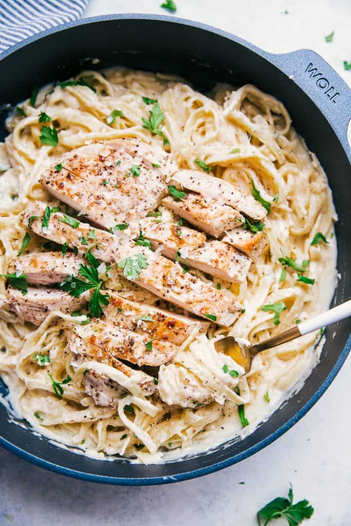overhead shot of chicken fettuccine alfredo in skillet