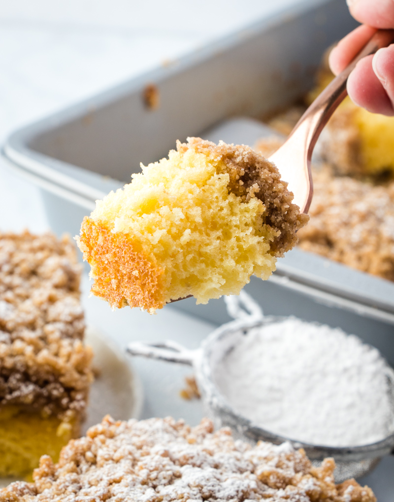 coffee cake on fork with pan in the background