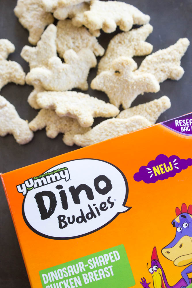 photo of dino buddies being poured out of box onto the sheet pan