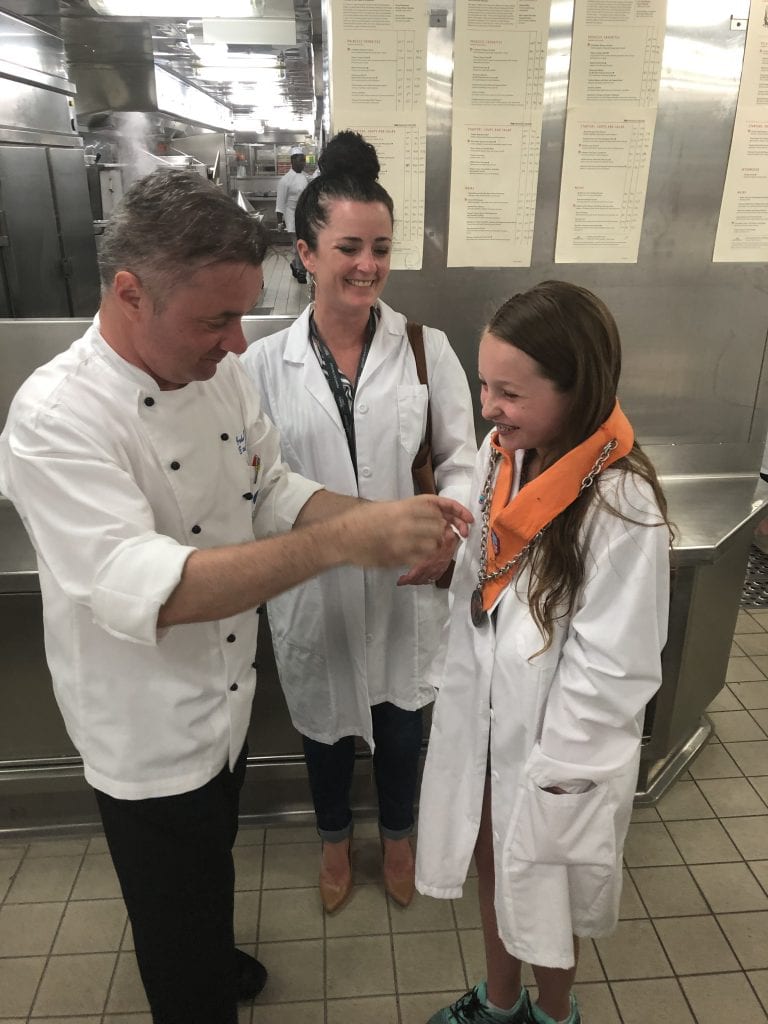 photo of chef putting medal on jordan