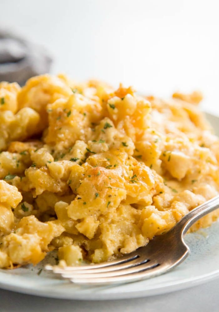 plate with baked mac and cheese with fork
