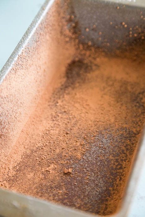 photo of bread pan that is oiled and dusted with cocoa powder