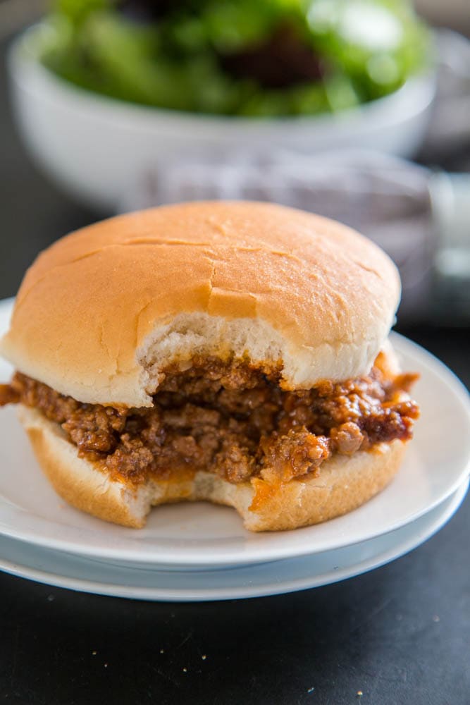 photo of a sandwich with a bite taken out of it