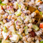 chickpea waldorf salad in bowl with lettuce