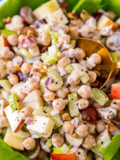 chickpea waldorf salad in bowl with lettuce