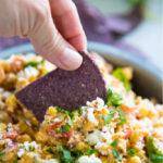 photo of a chip scooping some salad