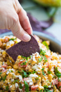 photo of a chip scooping some salad