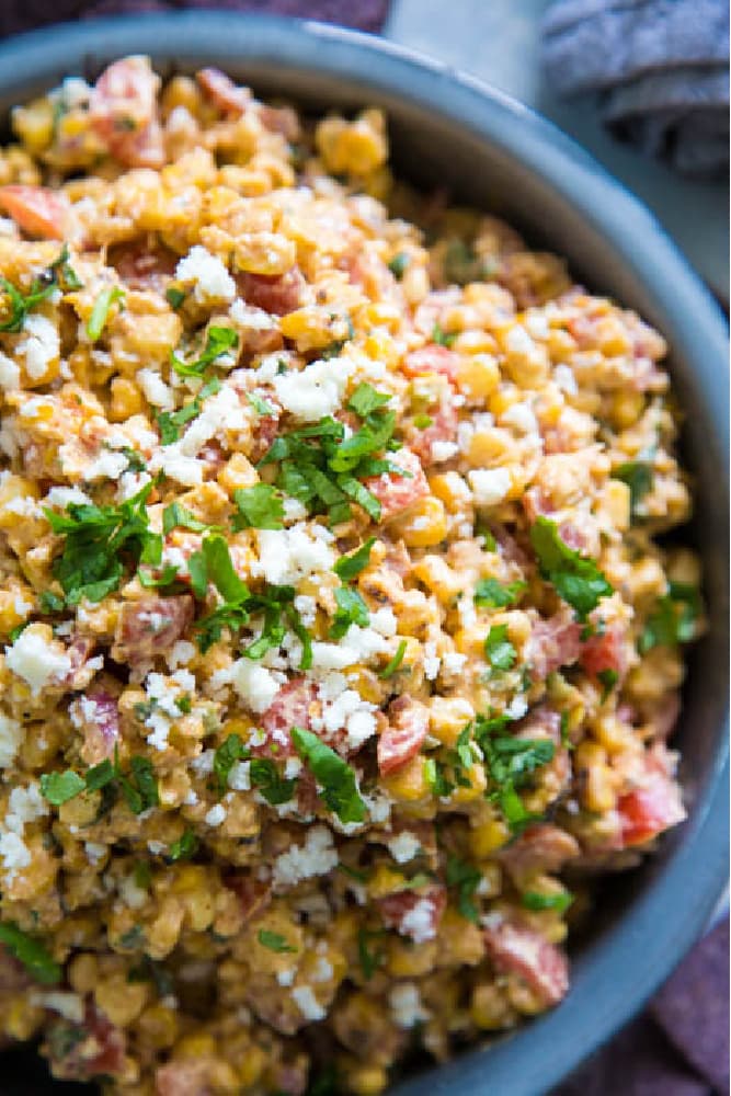 close-up photo of corn salad garnished with cilantro