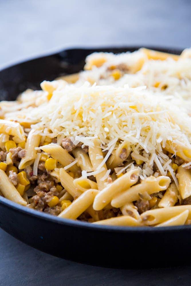 pasta, corn and sausage topped with cottage cheese