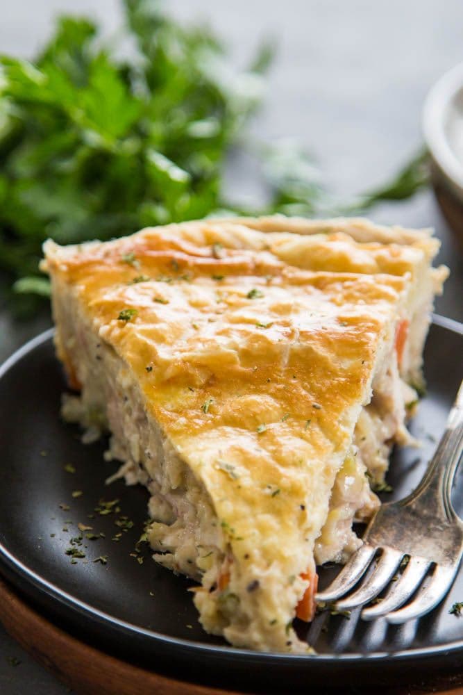 a slice of chicken pot pie on a plate