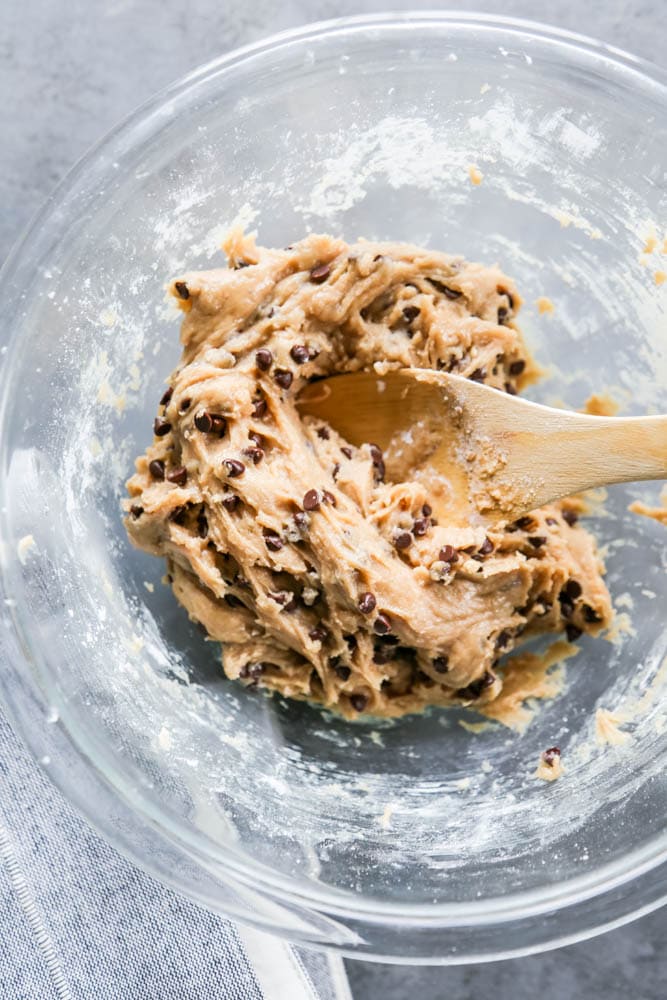 cookie dough being mixed in a bowl.