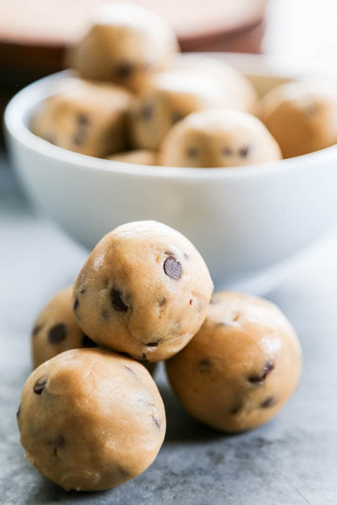 chocolate chip cookie dough balls in a pile.