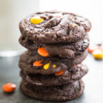 a stack of chocolate reese's cookies.