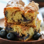 a stack of two slices of coffee cake on a plate.