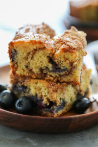 a stack of two slices of coffee cake on a plate.
