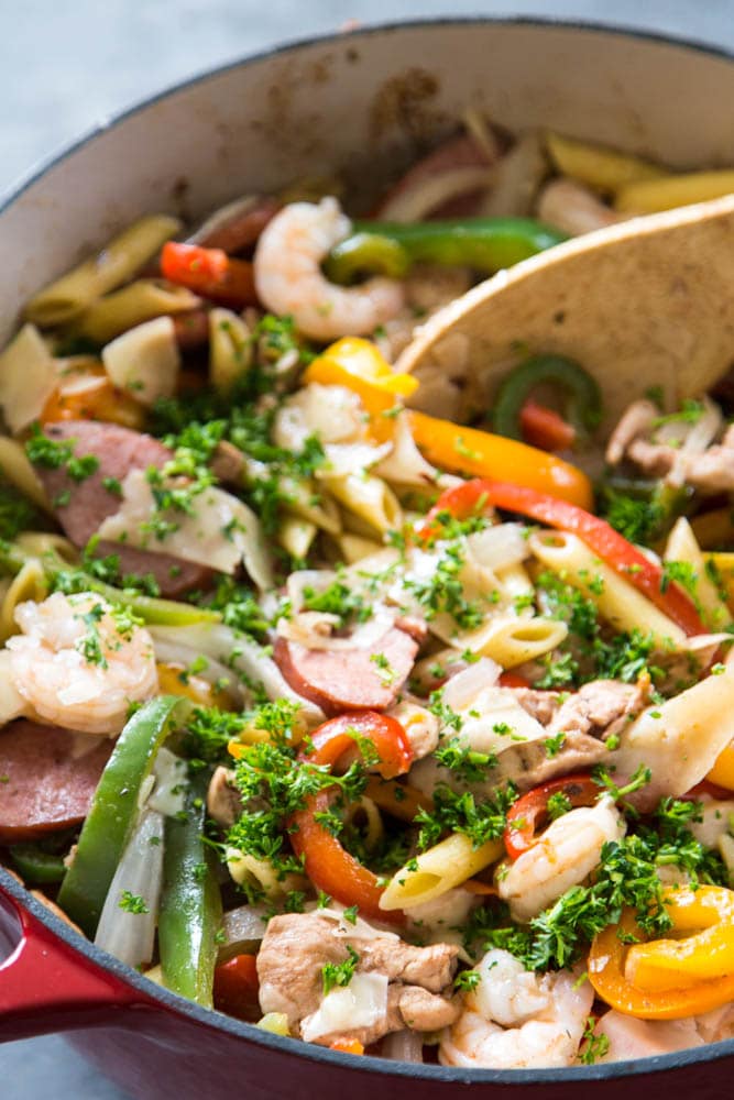 cajun pasta in pot with wooden spoons
