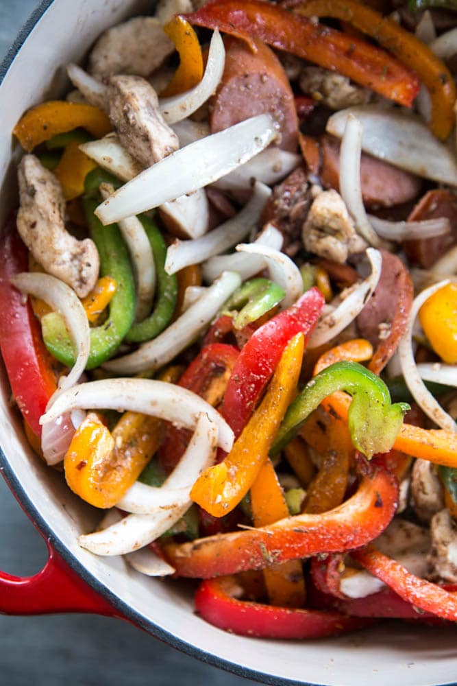 the vegetables and chicken cooking in a pan.