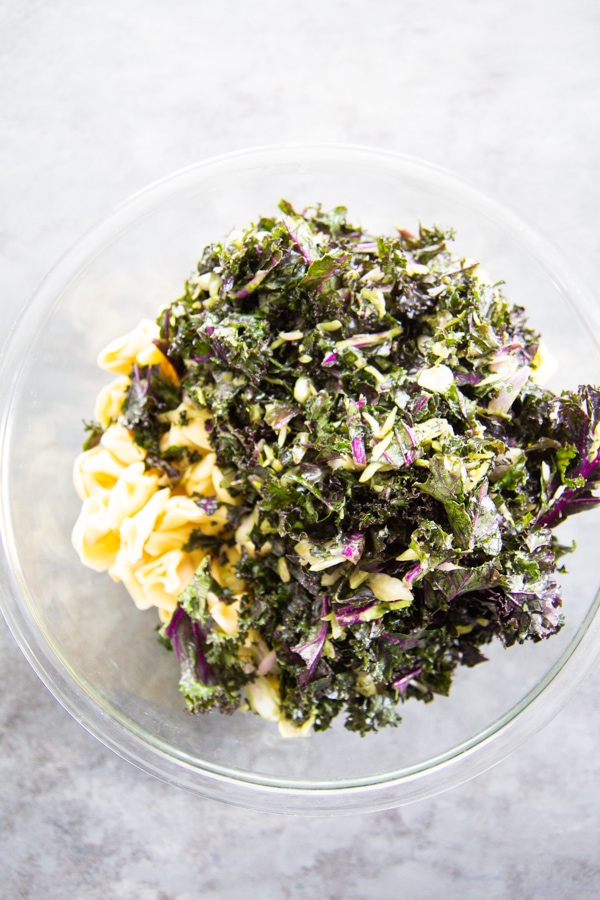 the kale and pasta in a bowl.
