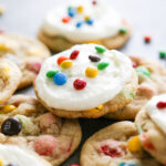 a pile of cookies with a frosted on top.