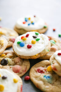 a pile of cookies with a frosted on top.