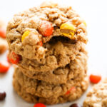 a stack of cookies with a bite taken out of the top one.