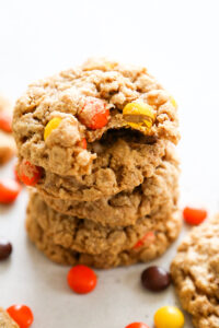 a stack of cookies with a bite taken out of the top one.