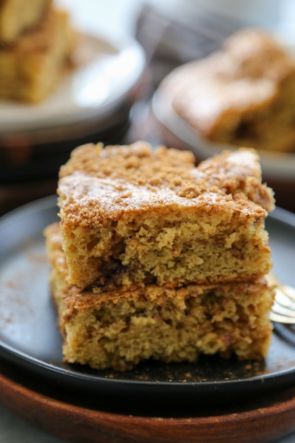 two slices of cake stacked on a plate.