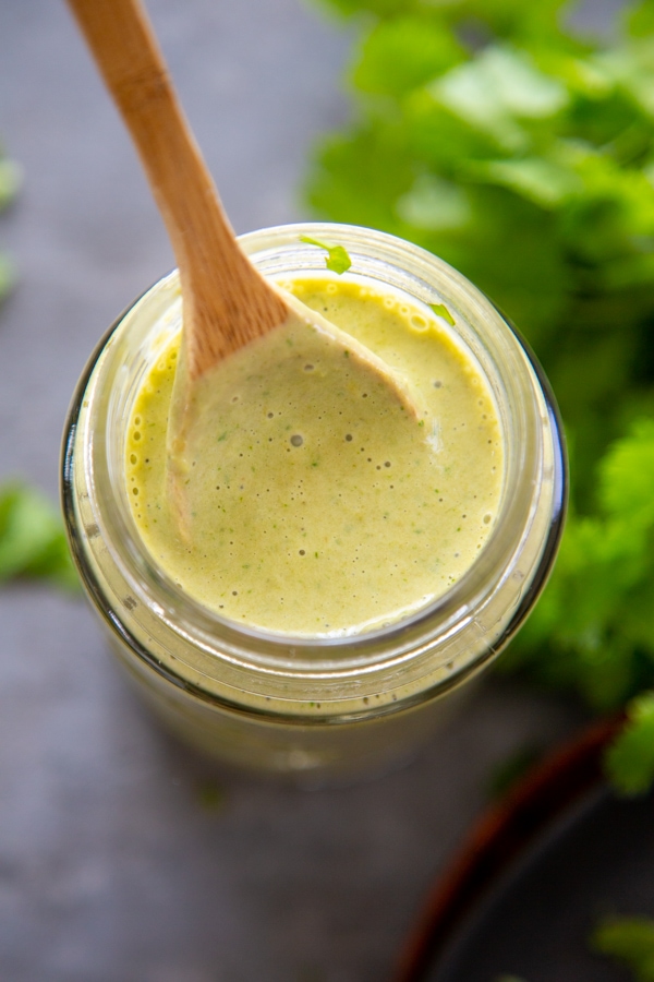 overhead shot of the sauce in a jar with a spoon.