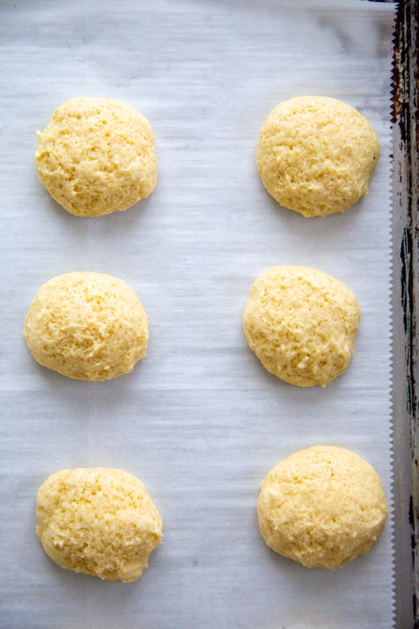 overhead shot of baked cookies on a baking sheet.