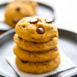 a stack of pumpkin chocolate chip cookies.