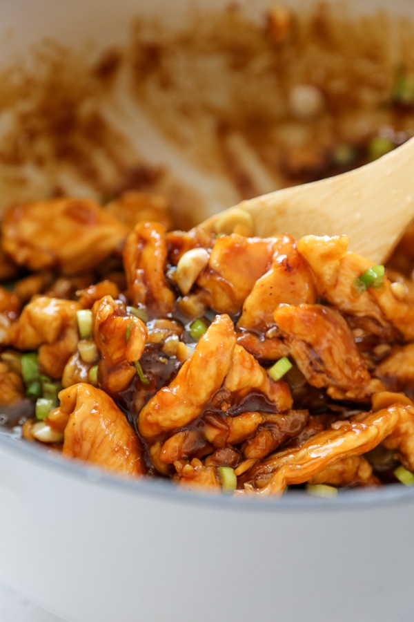 the cooked chicken and sauce in a pan.
