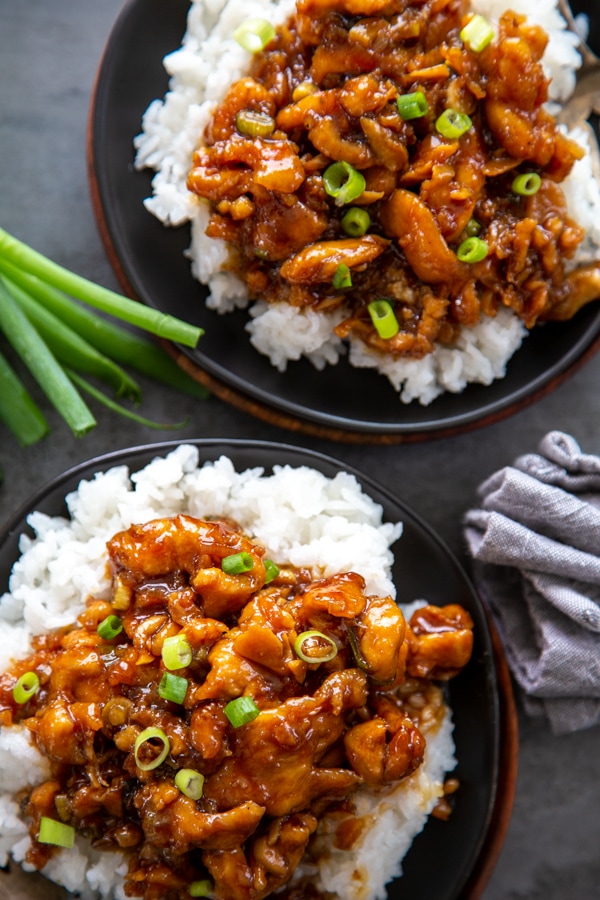 overhead photo of two plates of Mongolian chicken.