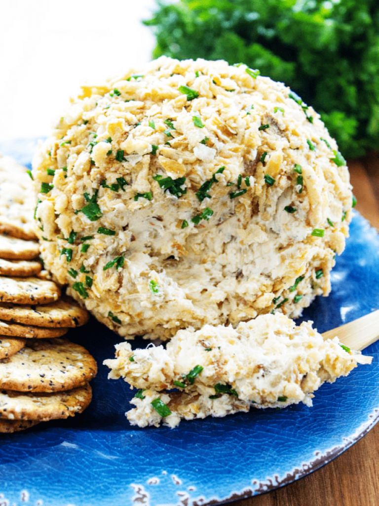 french onion cheese ball on plate with cracker